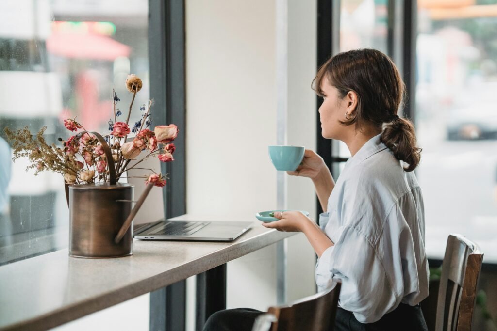 Brunette Woman Enjoy Coffee in Cafe